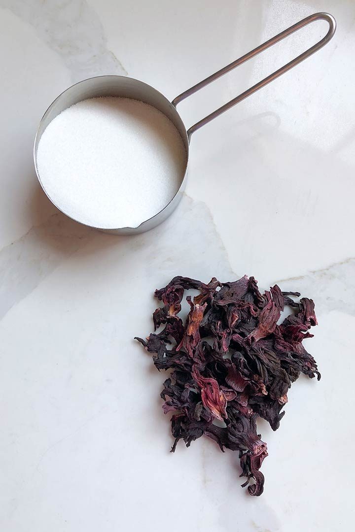 Ingredients-Agua-De-Jamaica, cup of sugar and hibiscus leaves.