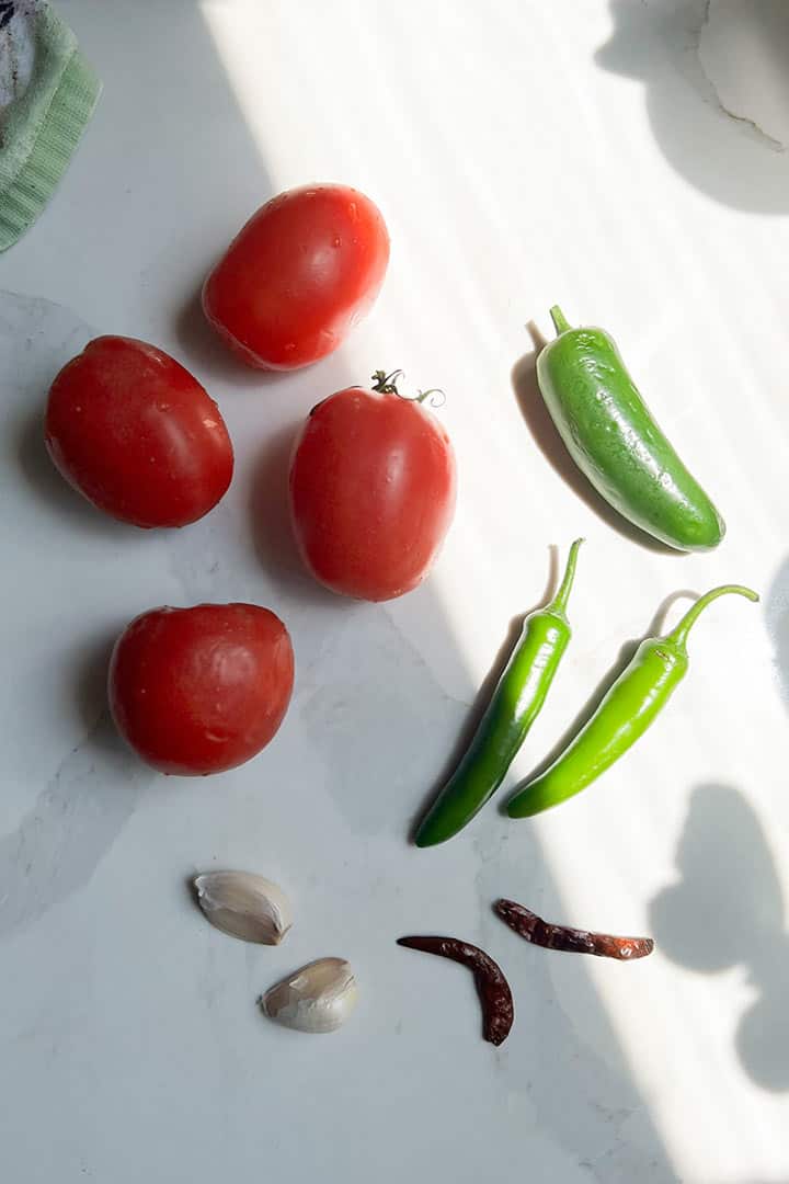 Ingredients sans onion to make Salsa Ranchera.