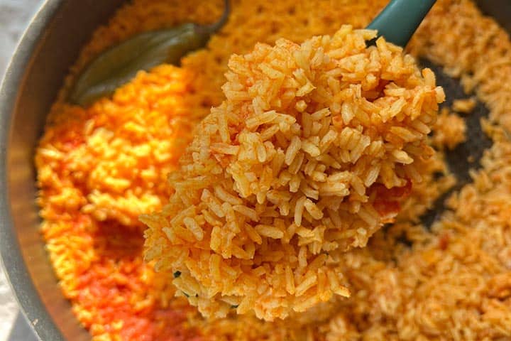 Large serving spoonful of red-rice.