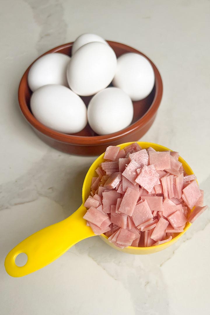 Ingredients for recipe: diced ham slices, and whole eggs.