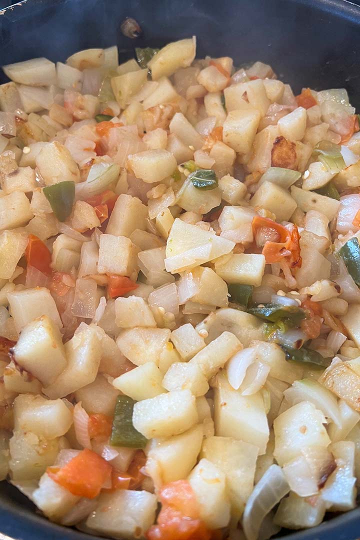 Papas mexicana with sauteed onions, jalapeno, tomato, and garlic.