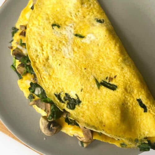 Spinach and Mushroom Omelette recipe on a plate.