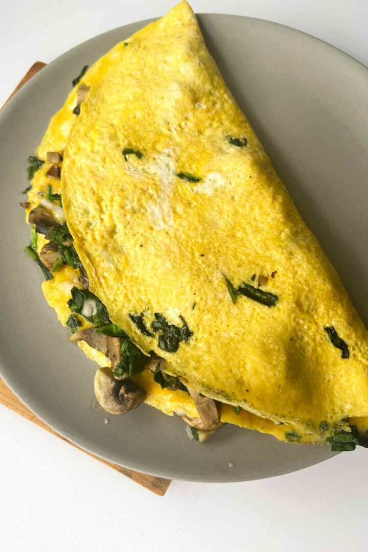 Spinach and Mushroom Omelette recipe on a plate.